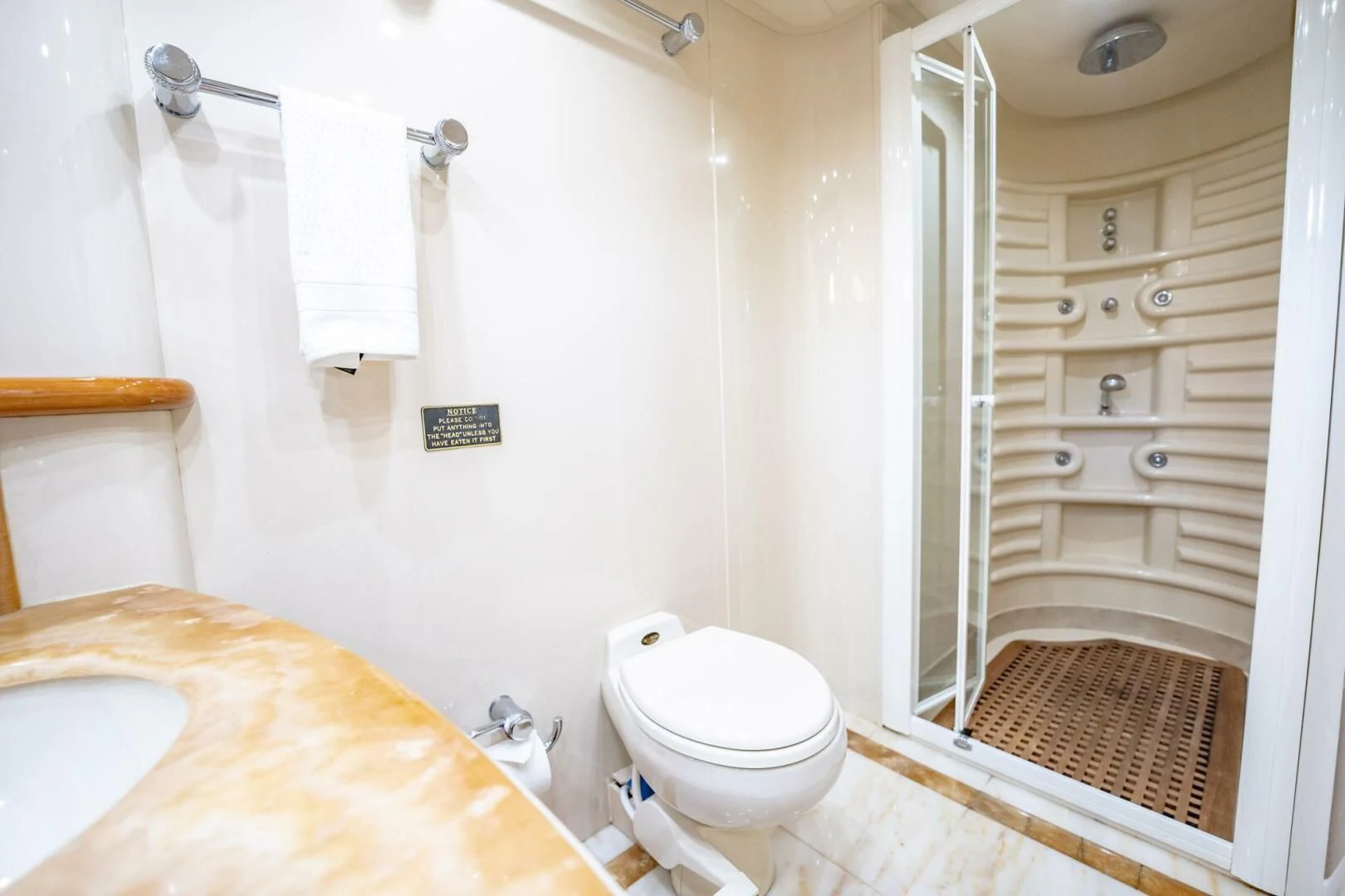 a bathroom with a shower and toilet aboard THE CURE Yacht for Sale