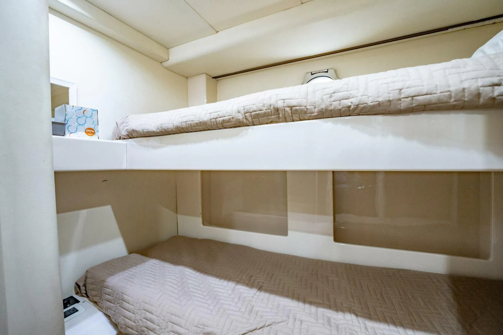 a white bed with a white sheet aboard THE CURE Yacht for Sale