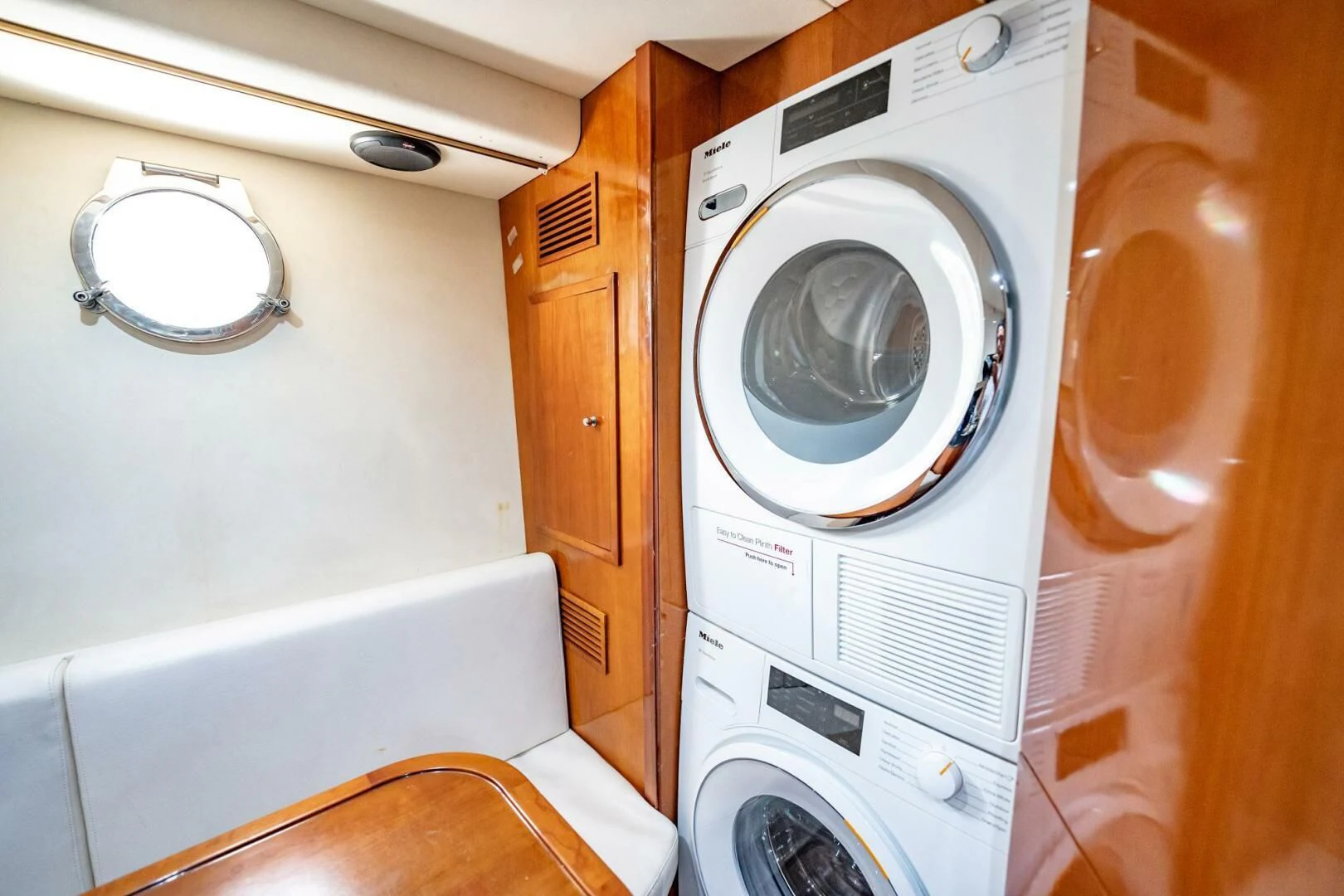 a washing machine in a room aboard THE CURE Yacht for Sale