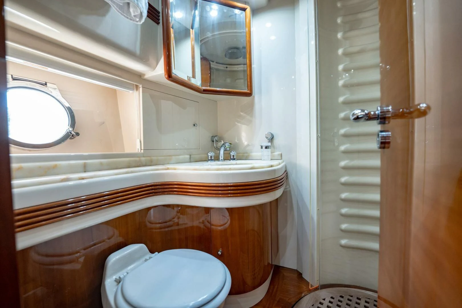 a bathroom with a toilet and a sink aboard THE CURE Yacht for Sale