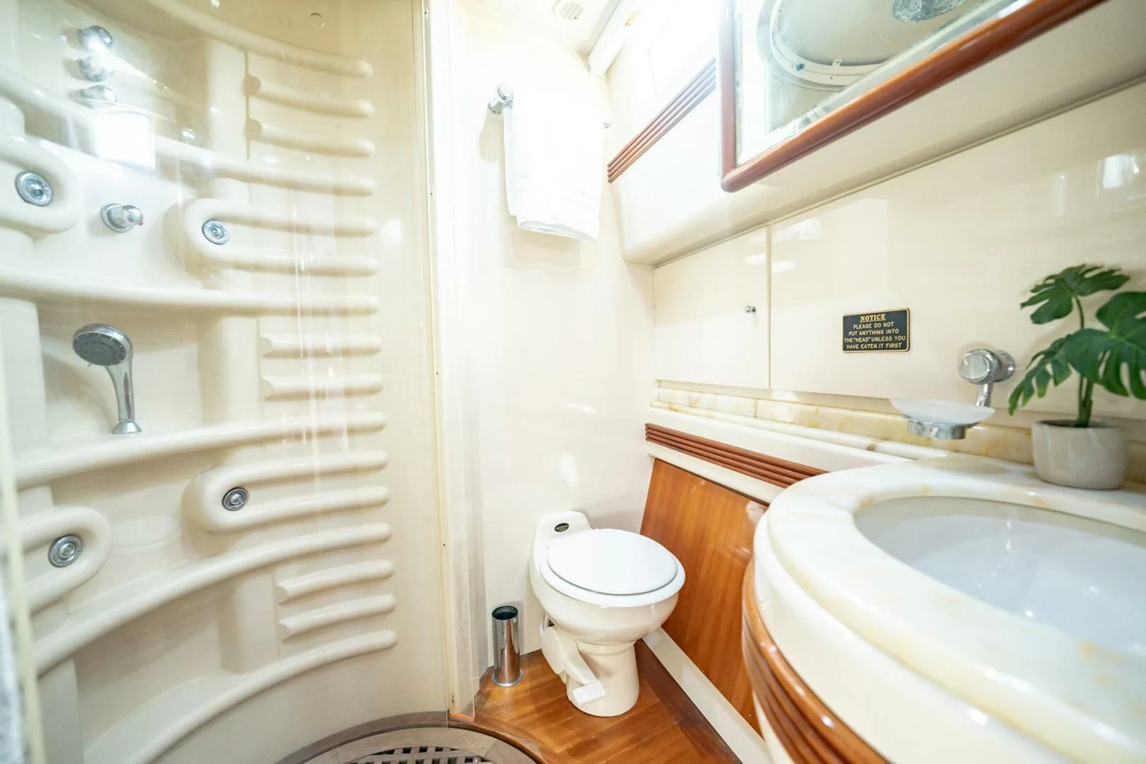 a bathroom with a toilet and sink aboard THE CURE Yacht for Sale