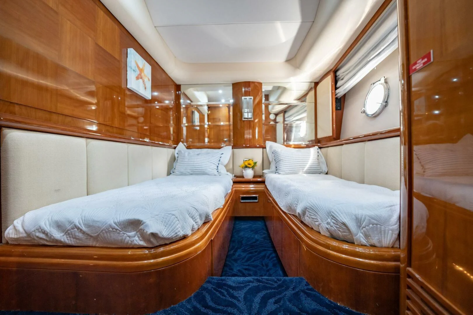 a room with two beds aboard THE CURE Yacht for Sale