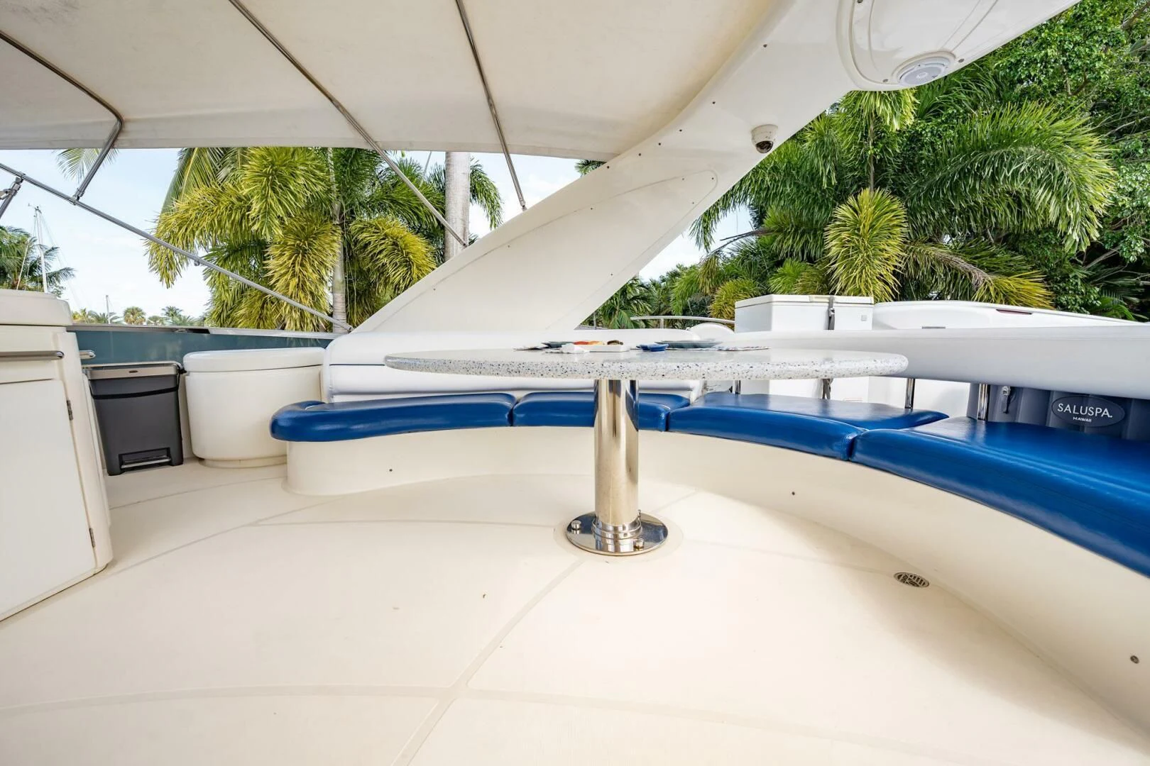 a pool with a table and chairs aboard THE CURE Yacht for Sale