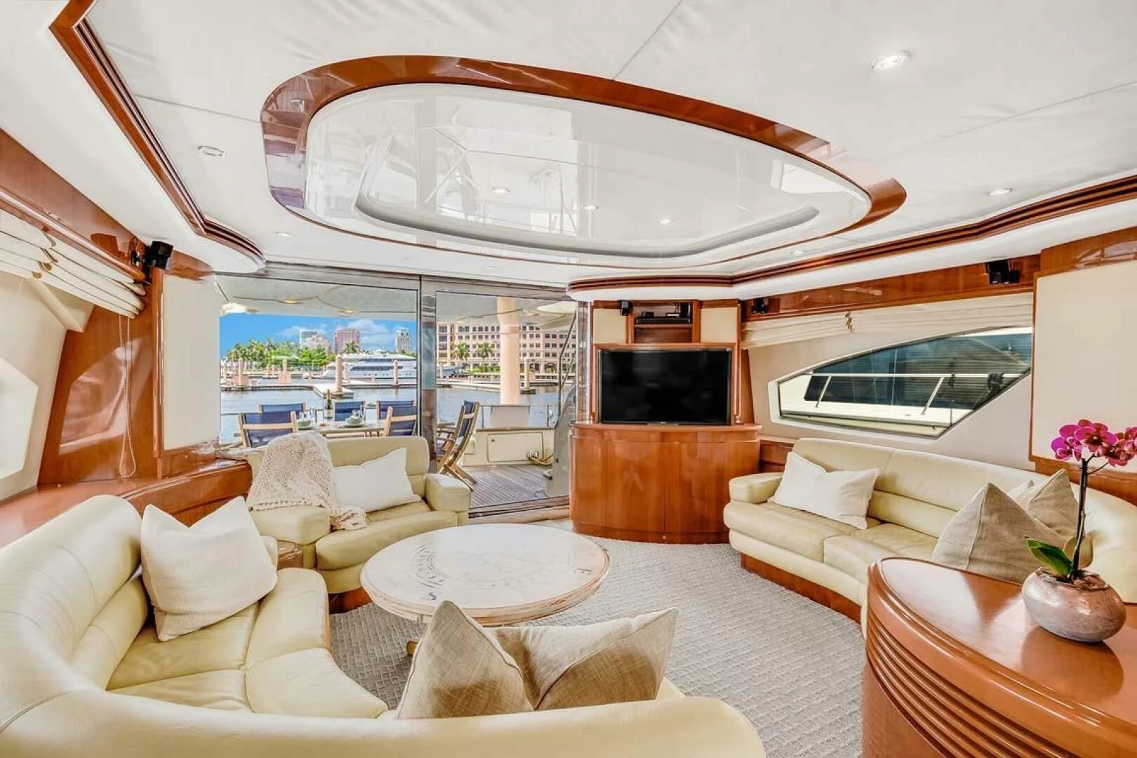 a living room with a fireplace aboard THE CURE Yacht for Sale