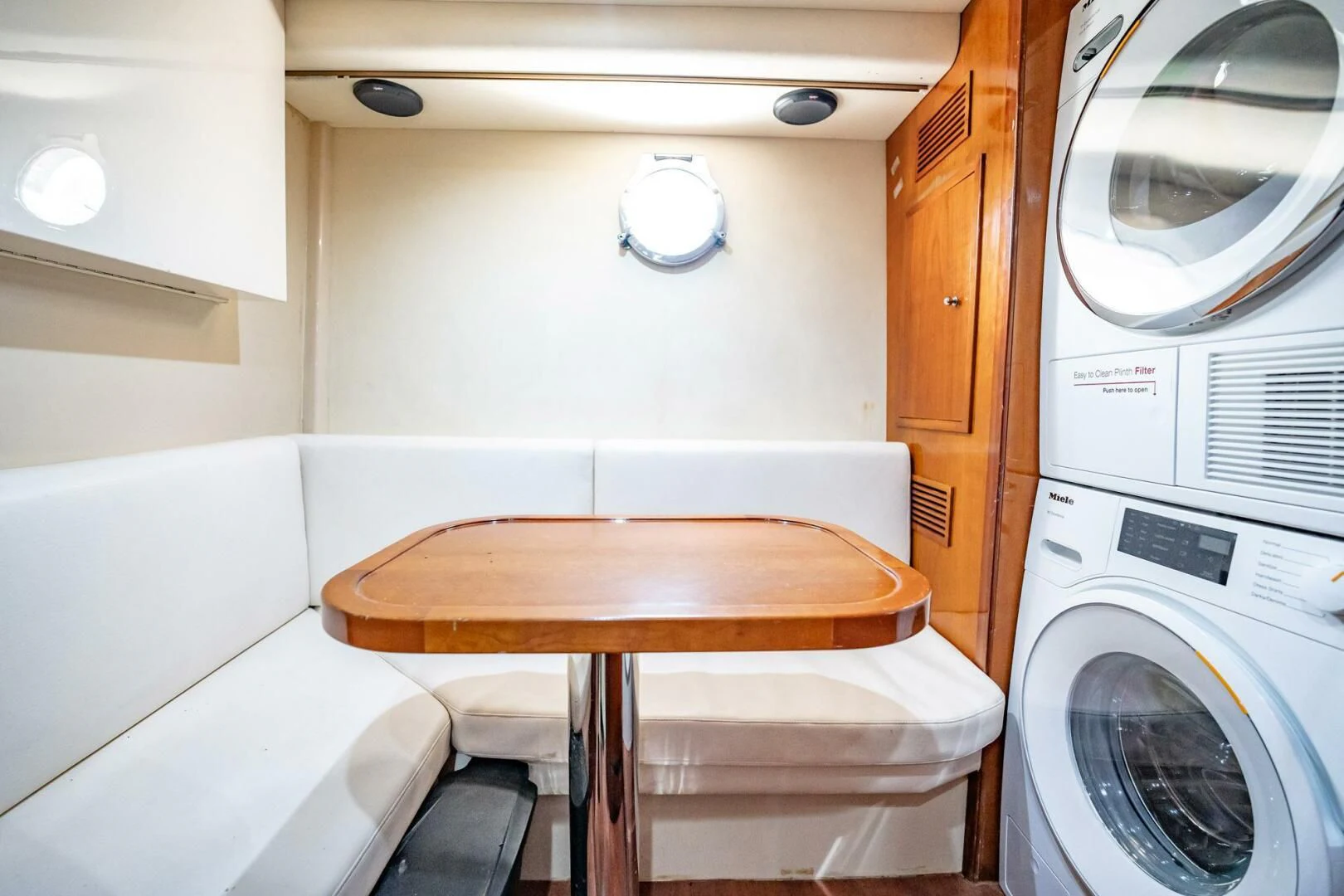 a small table in a small room aboard THE CURE Yacht for Sale