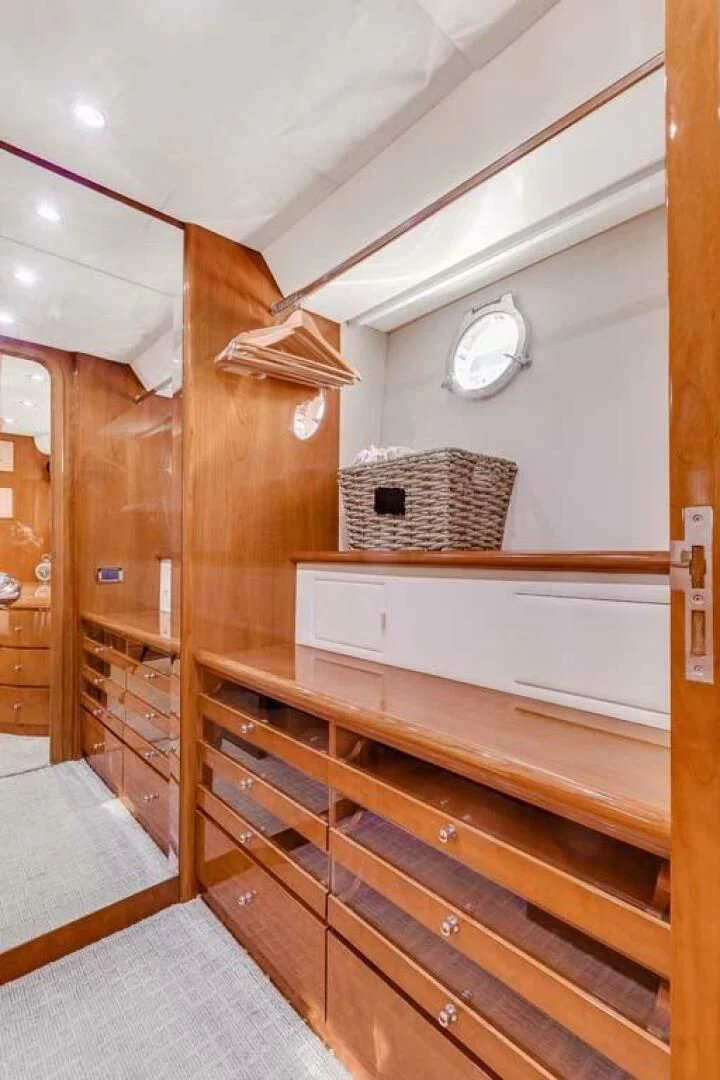 a wooden bunk bed in a room aboard THE CURE Yacht for Sale