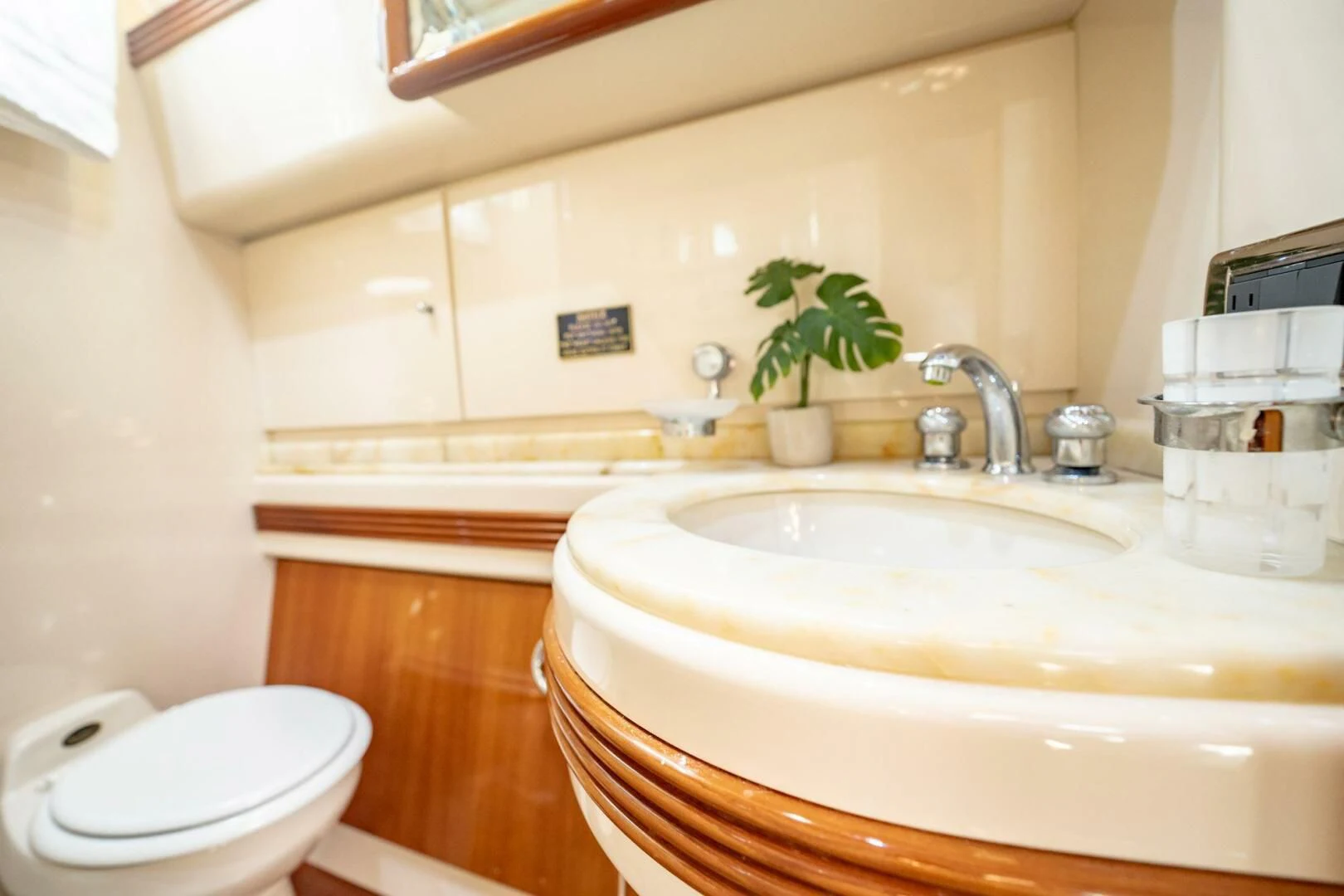 a bathroom with a sink and a toilet aboard THE CURE Yacht for Sale