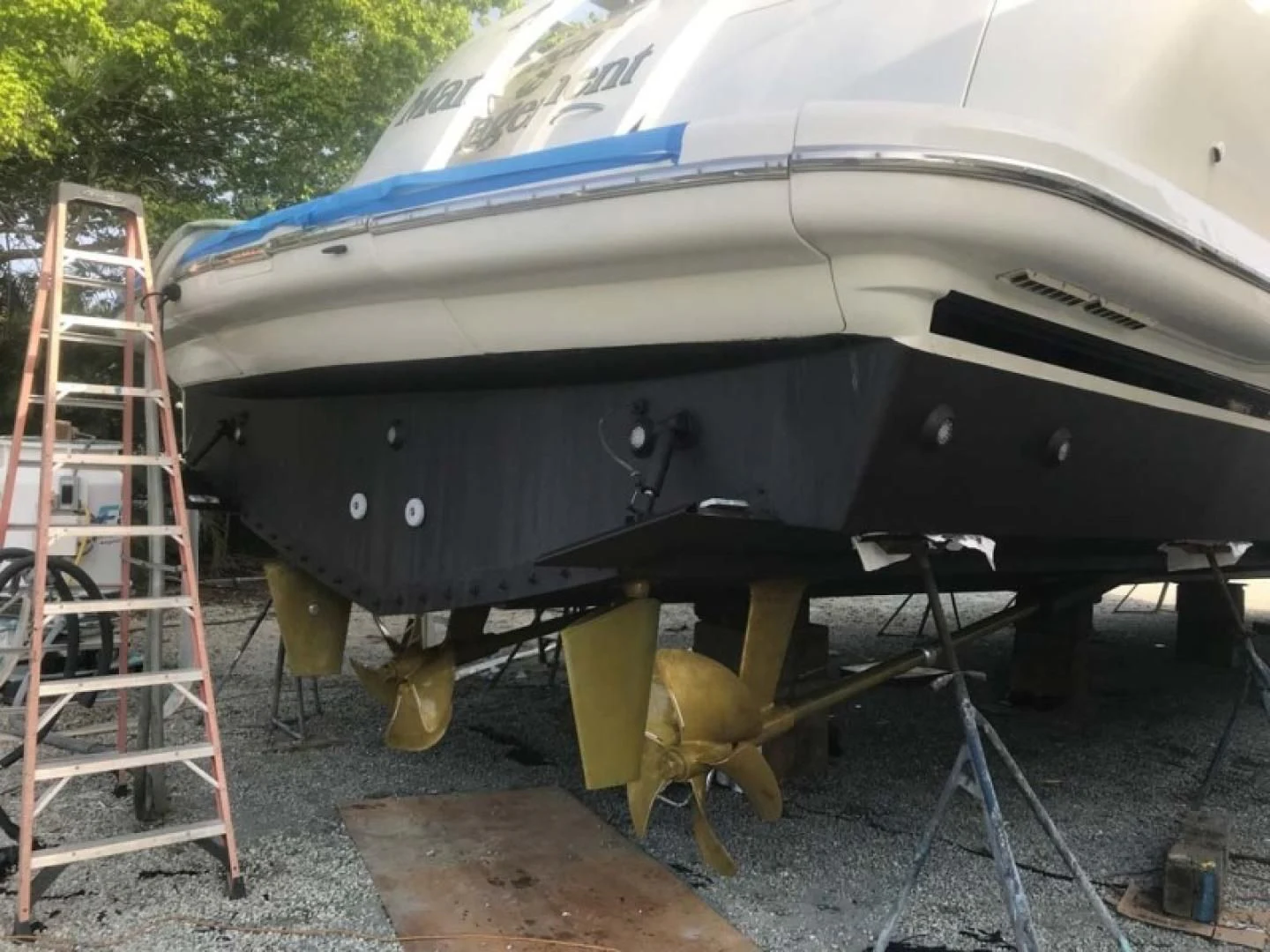 a large boat on a trailer aboard THE CURE Yacht for Sale