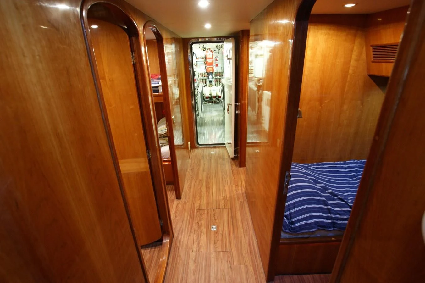 a room with wooden walls and a bed aboard LORI ANN Yacht for Sale