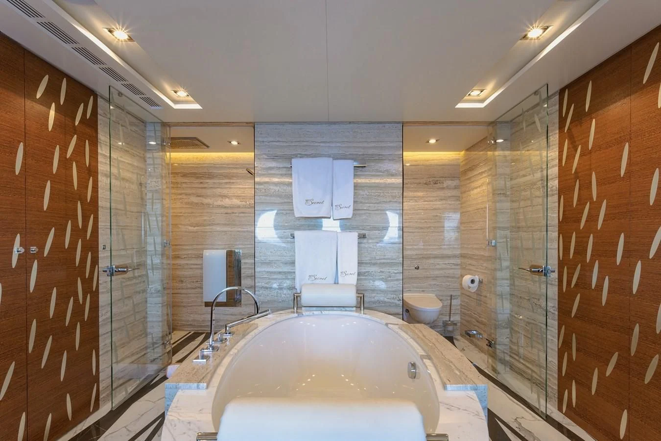 a bathroom with a bathtub and shower aboard MY SECRET Yacht for Sale