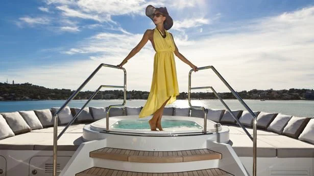 a person in a yellow dress on a boat aboard MY SECRET Yacht for Sale