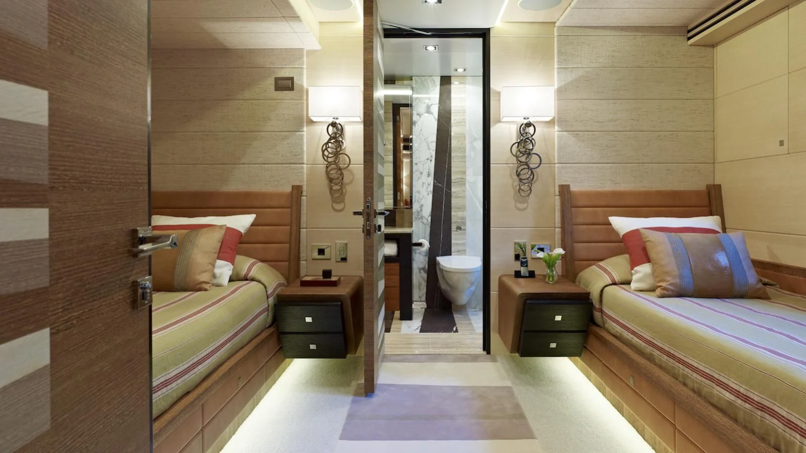 a bedroom with a bed and a closet aboard MY SECRET Yacht for Sale
