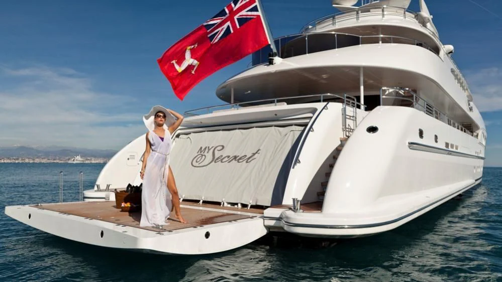a person standing on a boat aboard MY SECRET Yacht for Sale