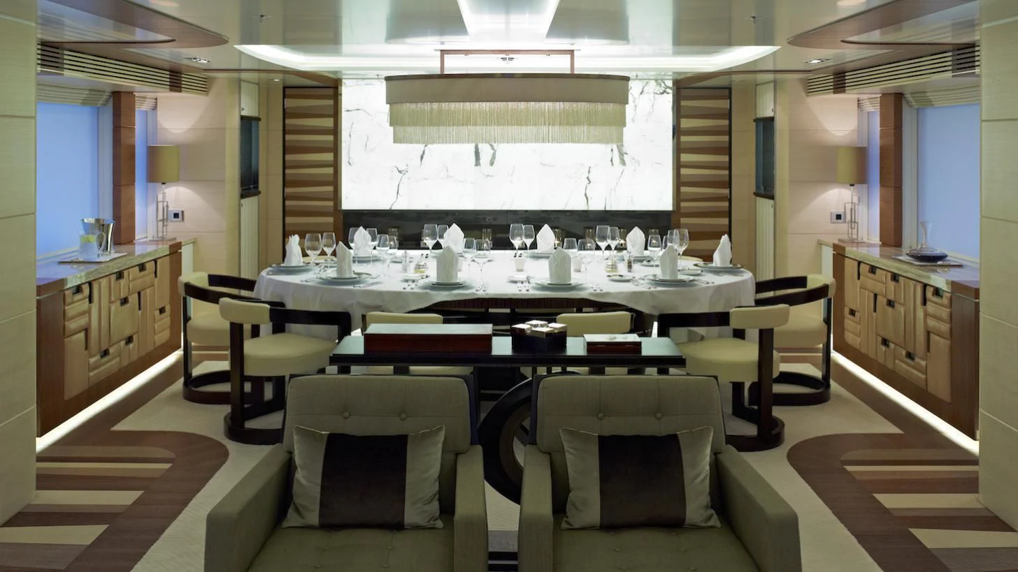a large kitchen with a table aboard MY SECRET Yacht for Sale