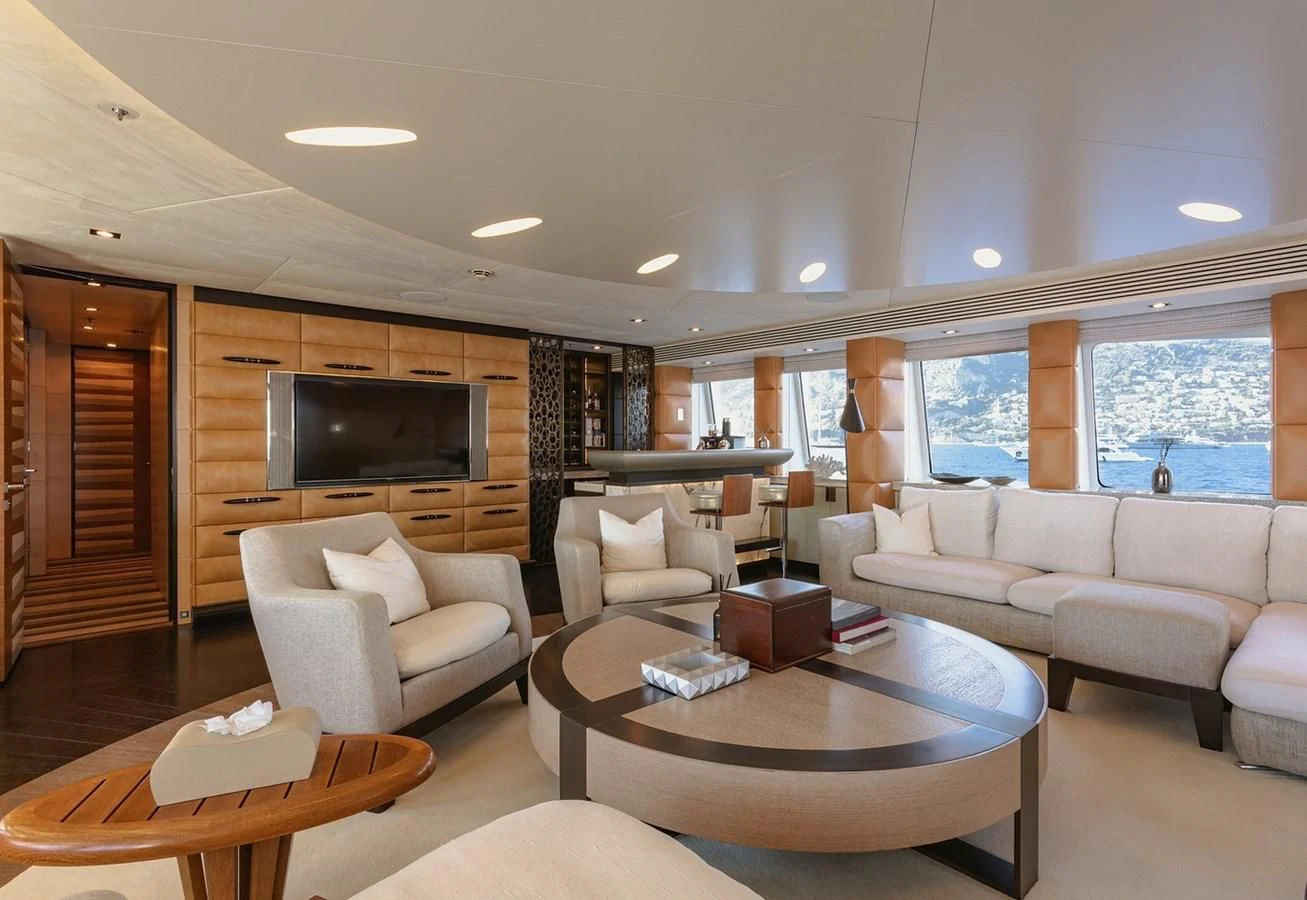 a living room with a large tv aboard MY SECRET Yacht for Sale