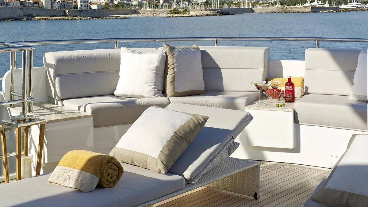 a couch with pillows on it aboard MY SECRET Yacht for Sale