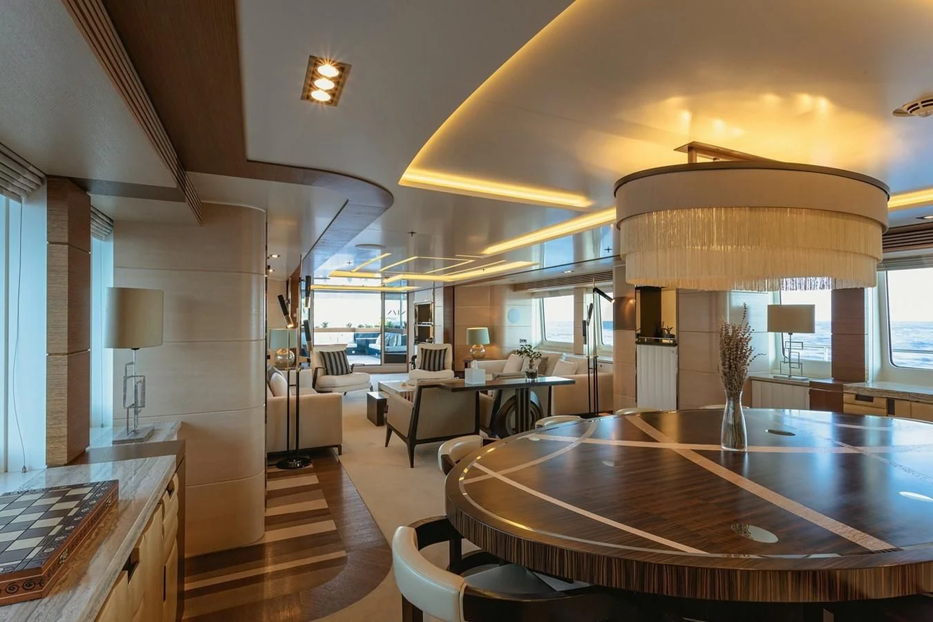 a large room with a table and chairs aboard MY SECRET Yacht for Sale