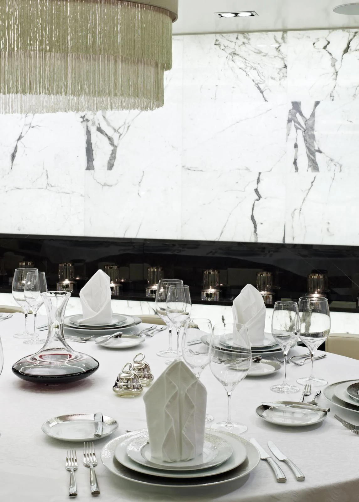 a table with plates and glasses aboard MY SECRET Yacht for Sale