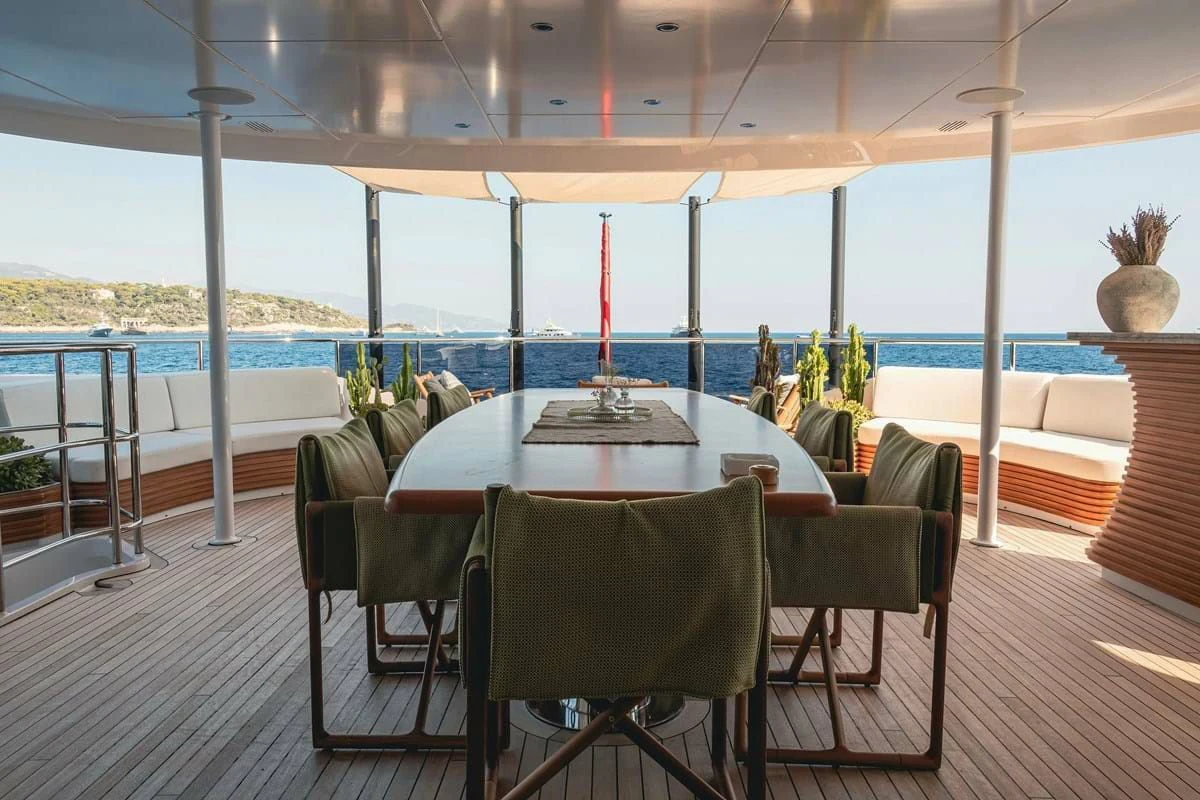 a table and chairs on a deck aboard MY SECRET Yacht for Sale