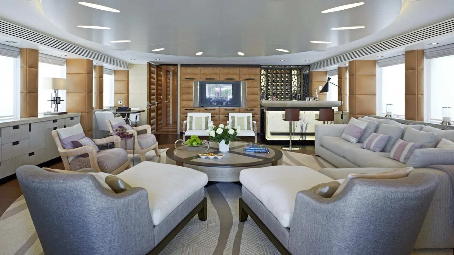 a living room with a couch and a television aboard MY SECRET Yacht for Sale