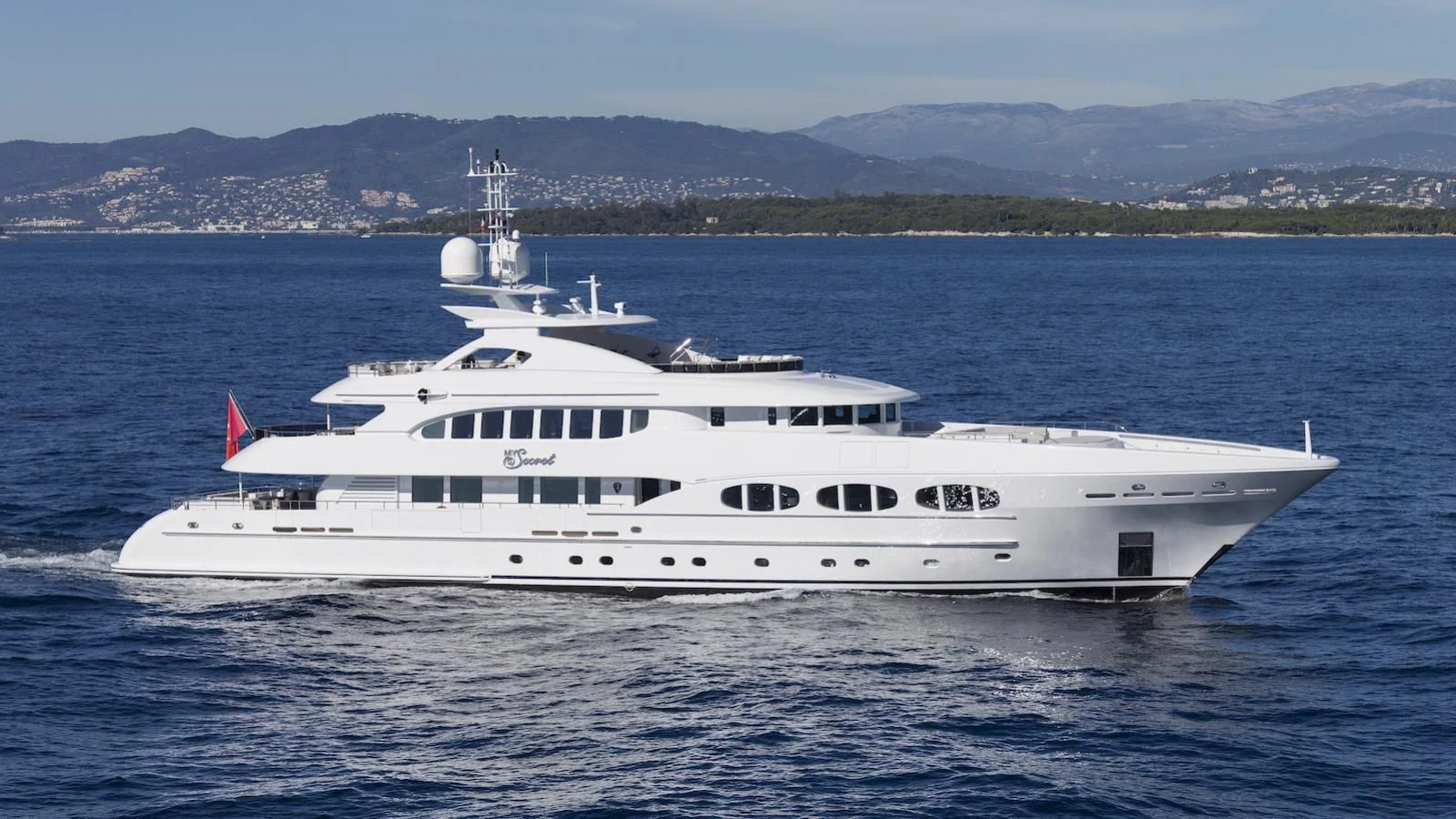 a large white boat on the water aboard MY SECRET Yacht for Sale