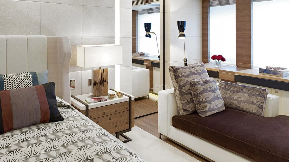 a bedroom with a bed and a couch aboard MY SECRET Yacht for Sale