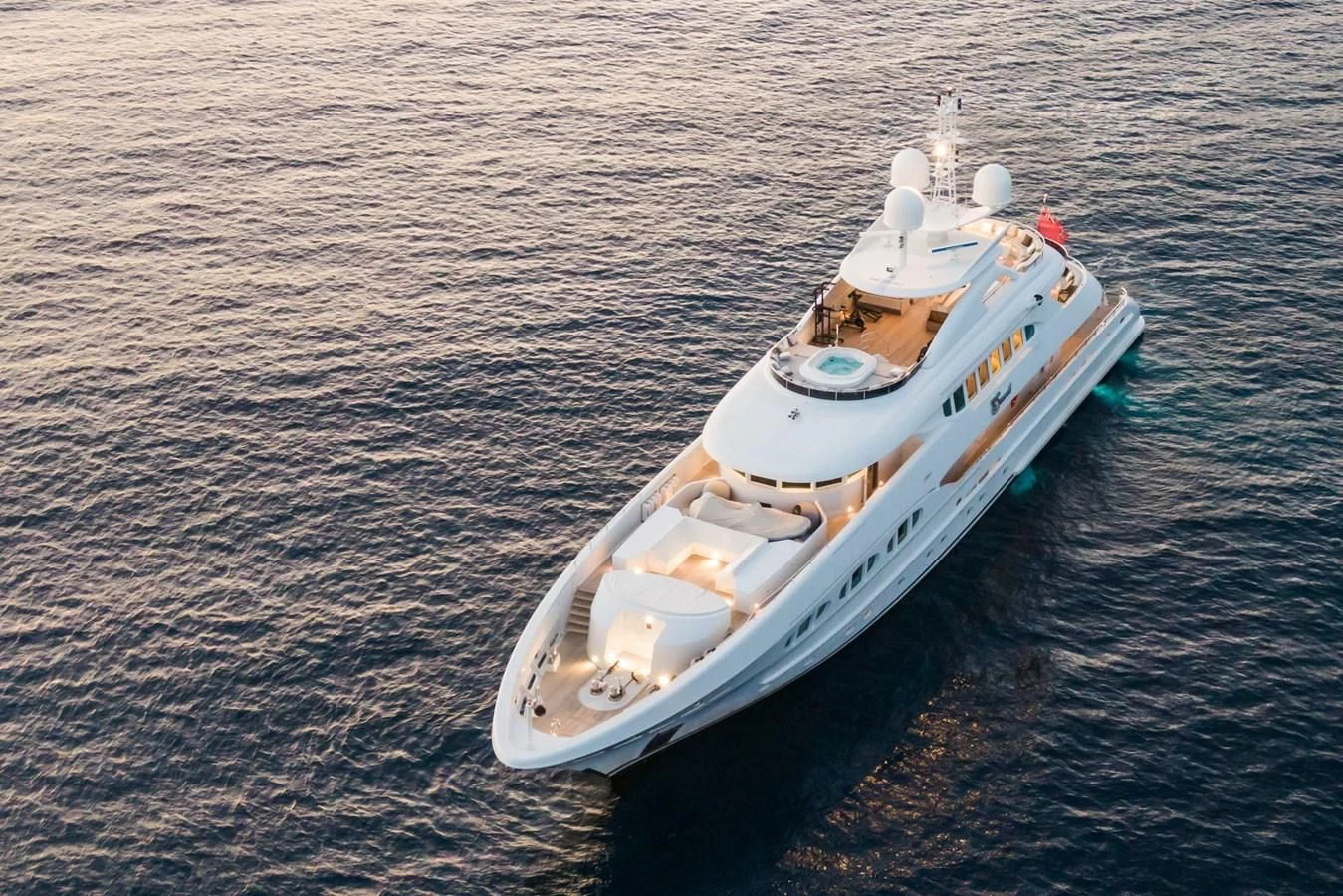a small white boat in the water aboard MY SECRET Yacht for Sale