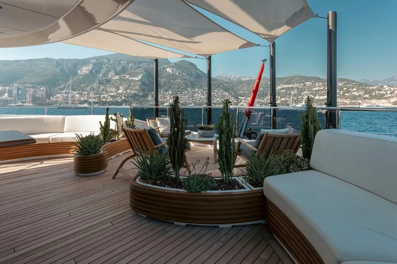 a deck with chairs and plants on it aboard MY SECRET Yacht for Sale