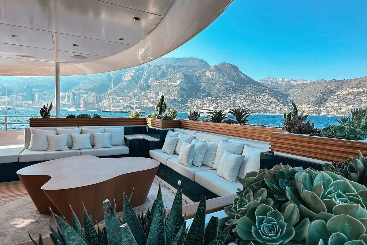 a patio with a large body of water in the background aboard MY SECRET Yacht for Sale