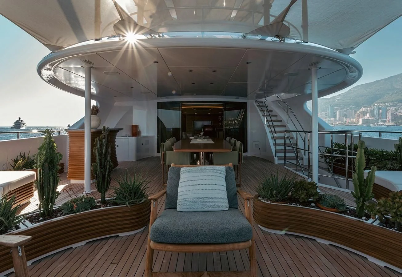 a room with a couch and a table and a view of the water aboard MY SECRET Yacht for Sale