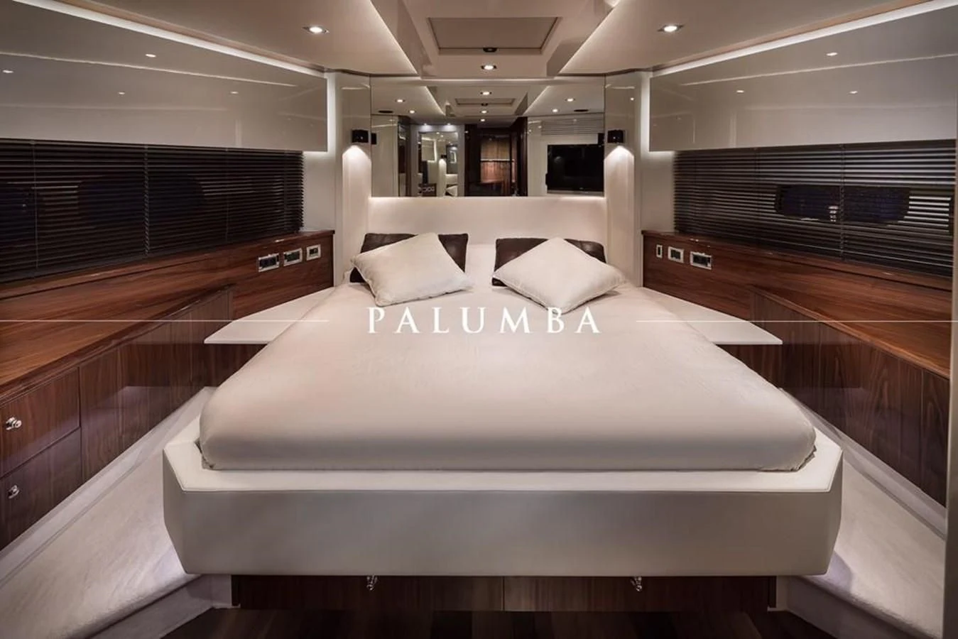 a large bed in a room aboard PALUMBA Yacht for Sale