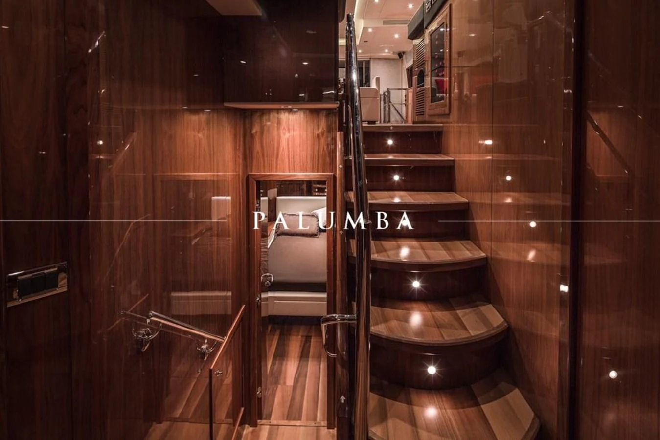a bathroom with a wood door aboard PALUMBA Yacht for Sale