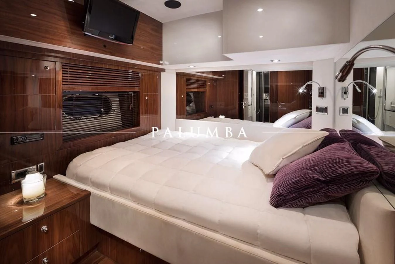 a bed in a room aboard PALUMBA Yacht for Sale