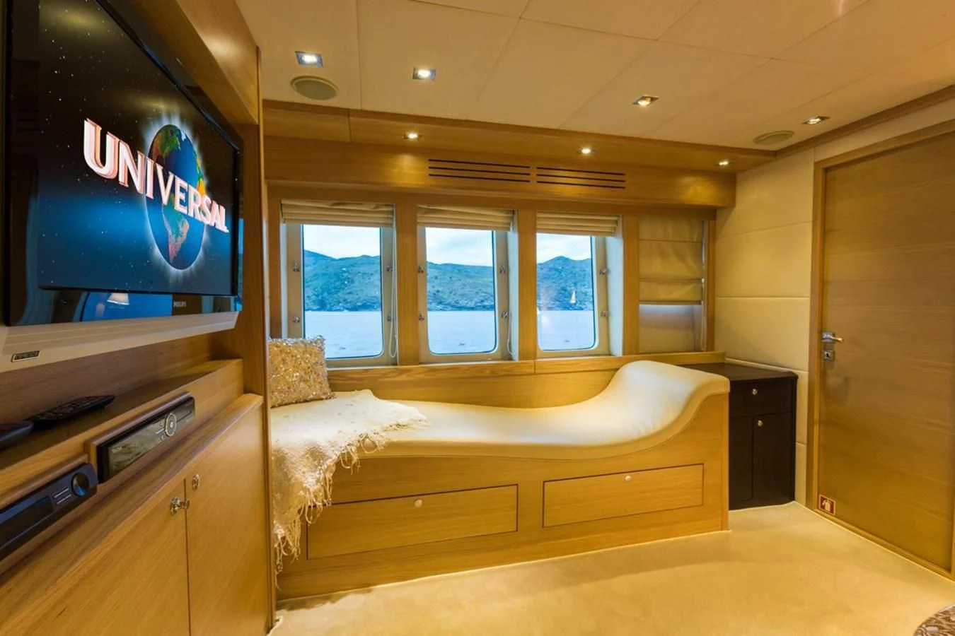 a room with a bed and tv aboard GOOD VIBES Yacht for Sale
