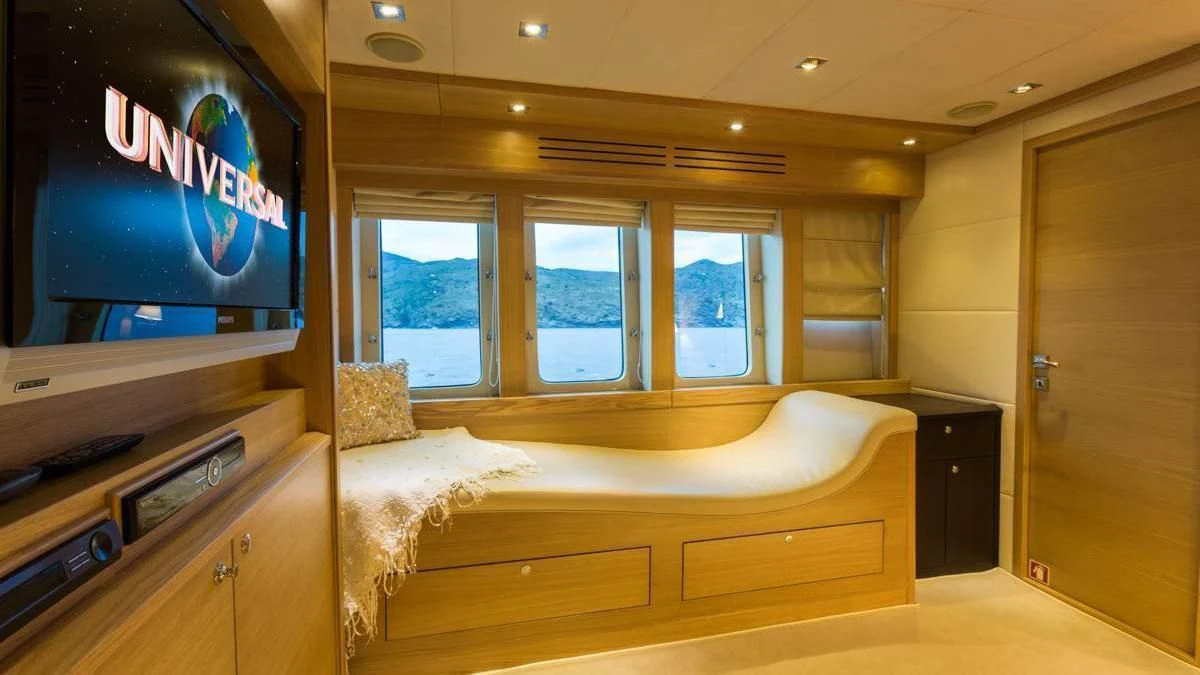 a room with a bed and a tv aboard GOOD VIBES Yacht for Sale
