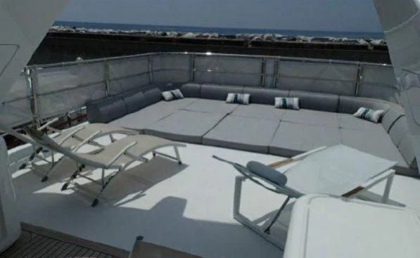 a room with a couch and a table aboard GOOD VIBES Yacht for Sale