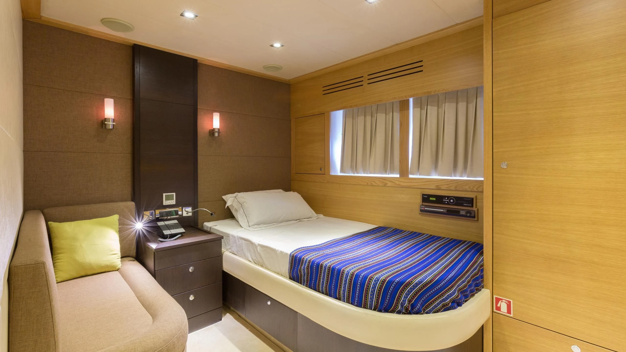 a room with a bed and a window aboard GOOD VIBES Yacht for Sale