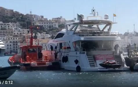a large white boat with a red boat on it aboard GOOD VIBES Yacht for Sale