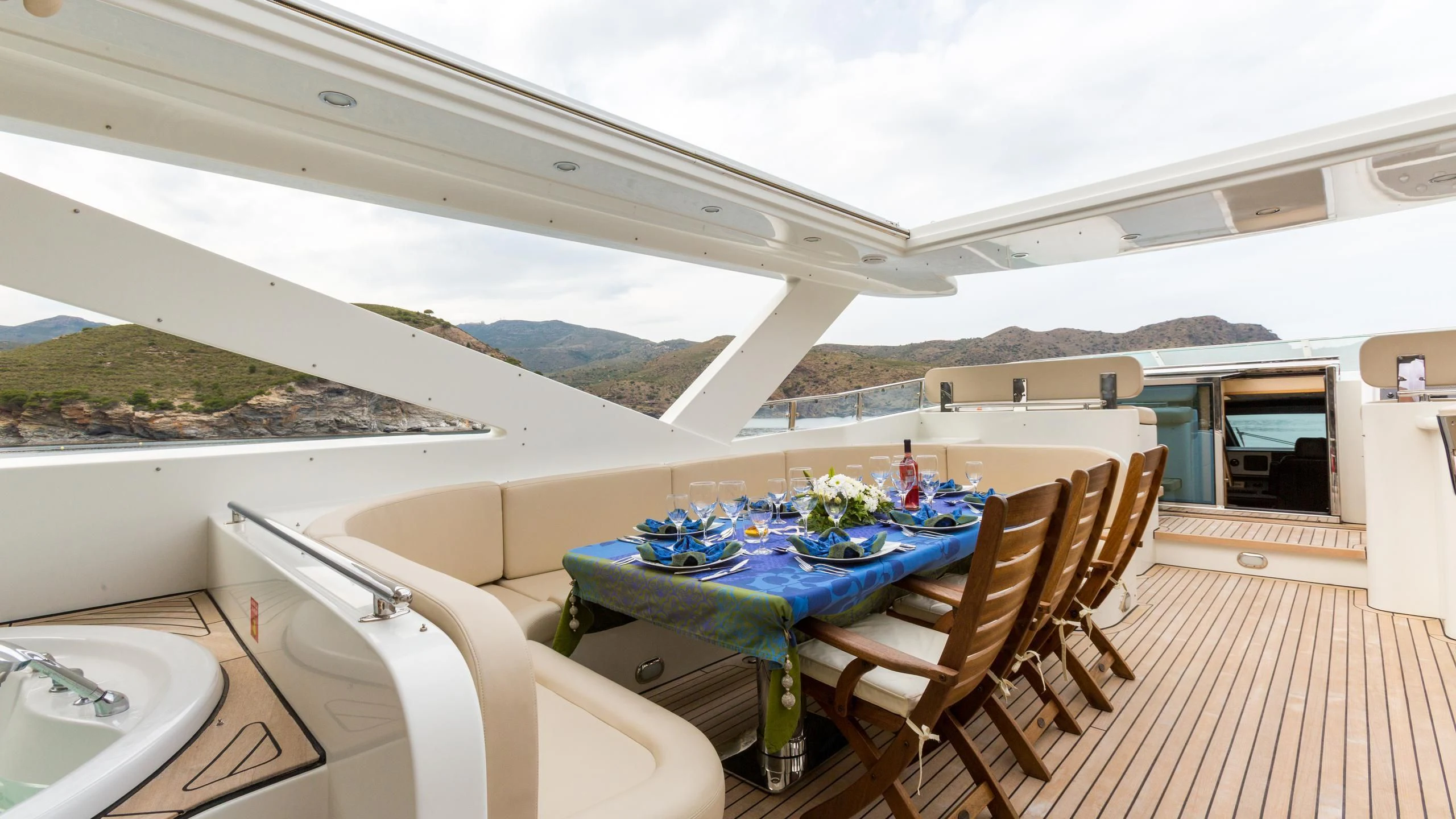 a table and chairs on a deck aboard GOOD VIBES Yacht for Sale