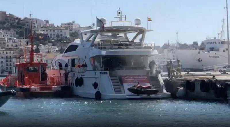 a large white boat with a red and black boat on it aboard GOOD VIBES Yacht for Sale