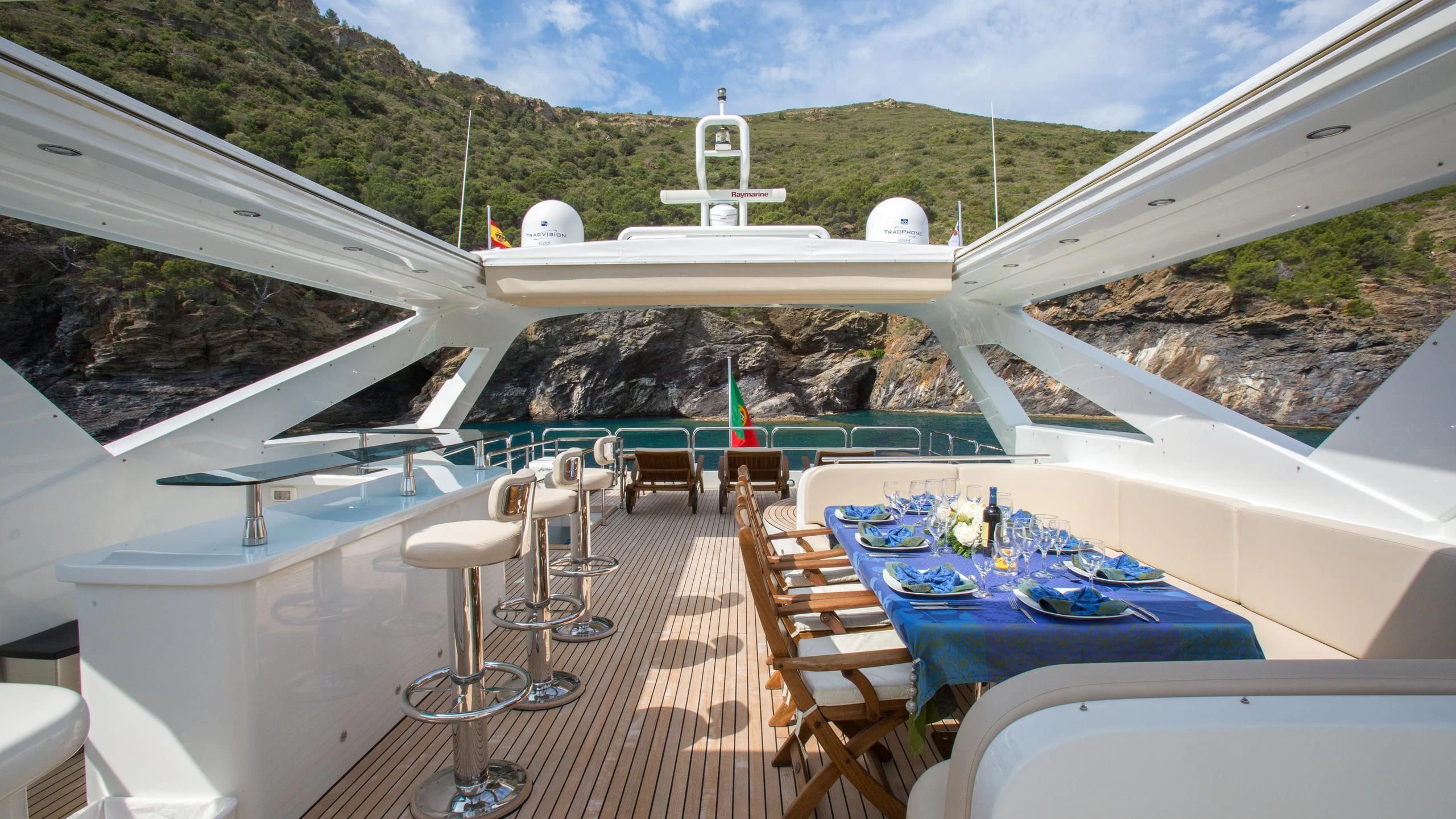 a pool with tables and chairs aboard GOOD VIBES Yacht for Sale