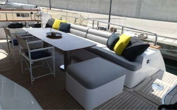 a room with a couch and a table aboard GOOD VIBES Yacht for Sale