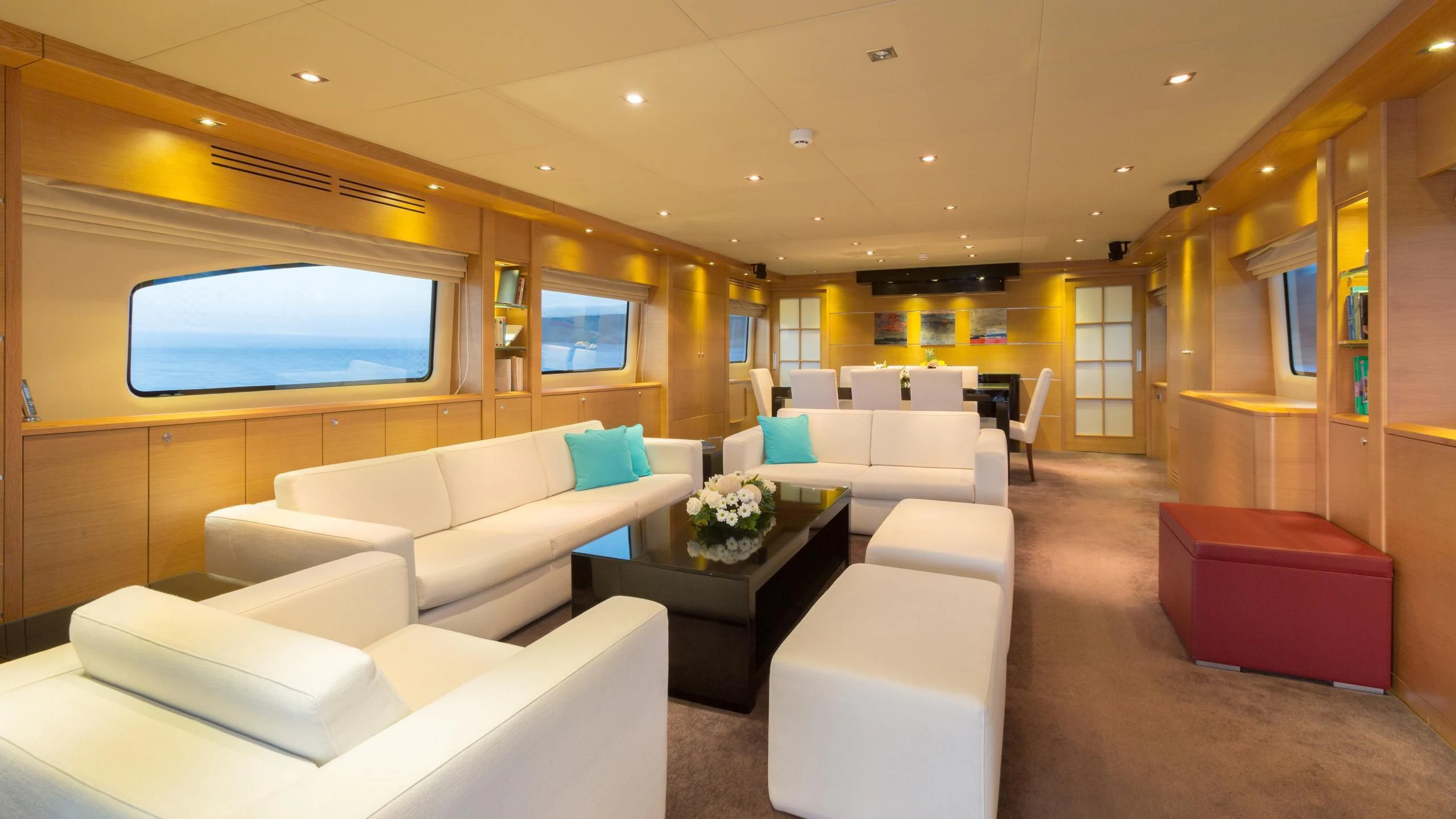 a room with couches and a tv aboard GOOD VIBES Yacht for Sale