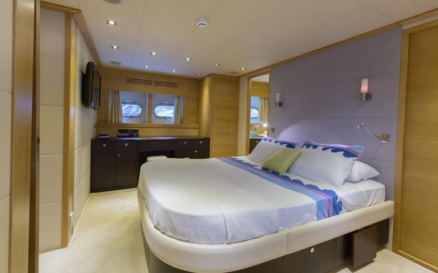 a room with a bed and a desk aboard GOOD VIBES Yacht for Sale
