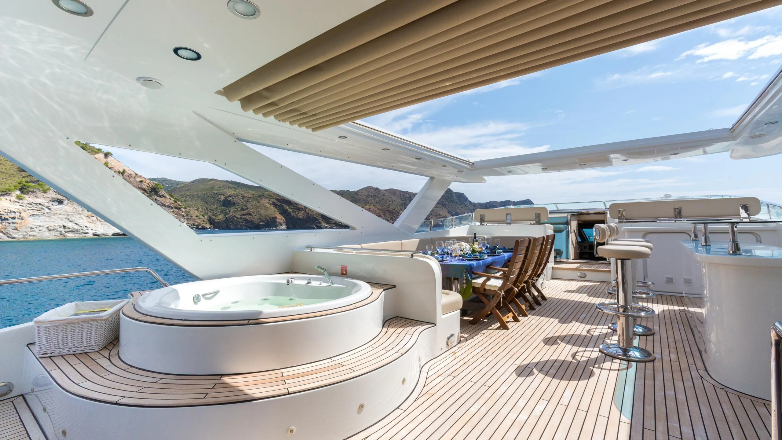 a large white pool with a table and chairs aboard GOOD VIBES Yacht for Sale