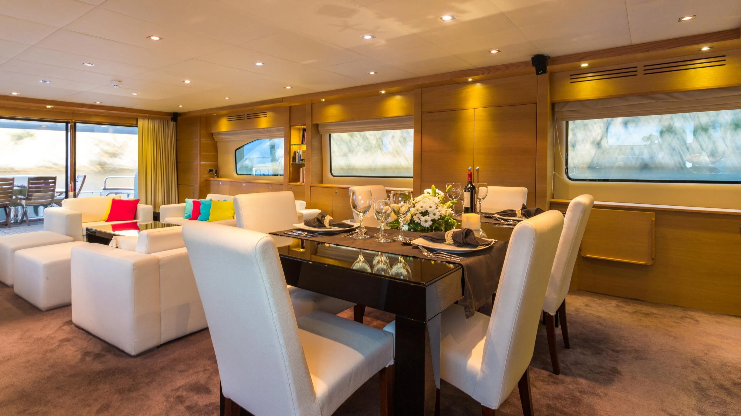 a room with a table and chairs aboard GOOD VIBES Yacht for Sale