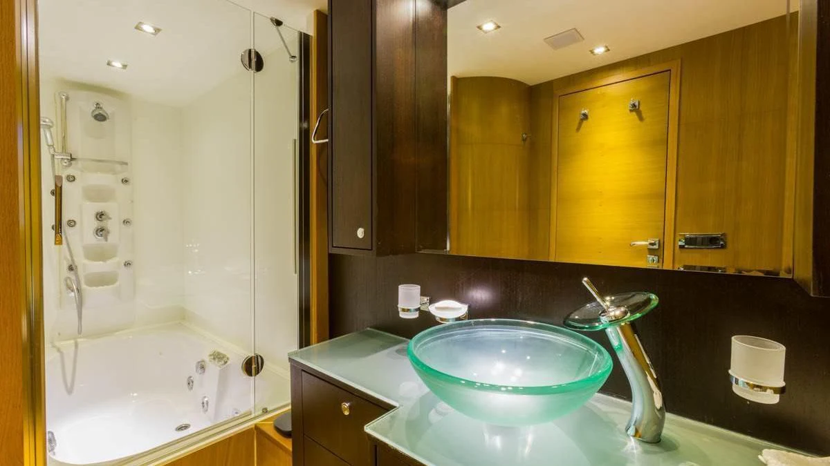 a bathroom with a sink and a bathtub aboard GOOD VIBES Yacht for Sale