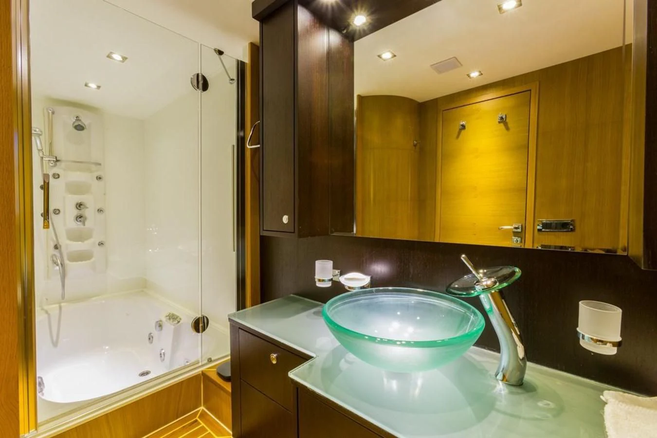 a bathroom with a large mirror aboard GOOD VIBES Yacht for Sale