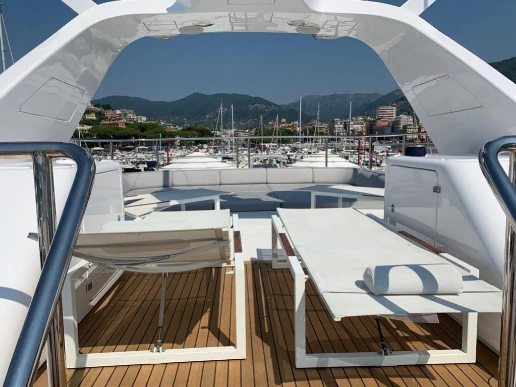 a deck with a view of a city and water aboard GOOD VIBES Yacht for Sale