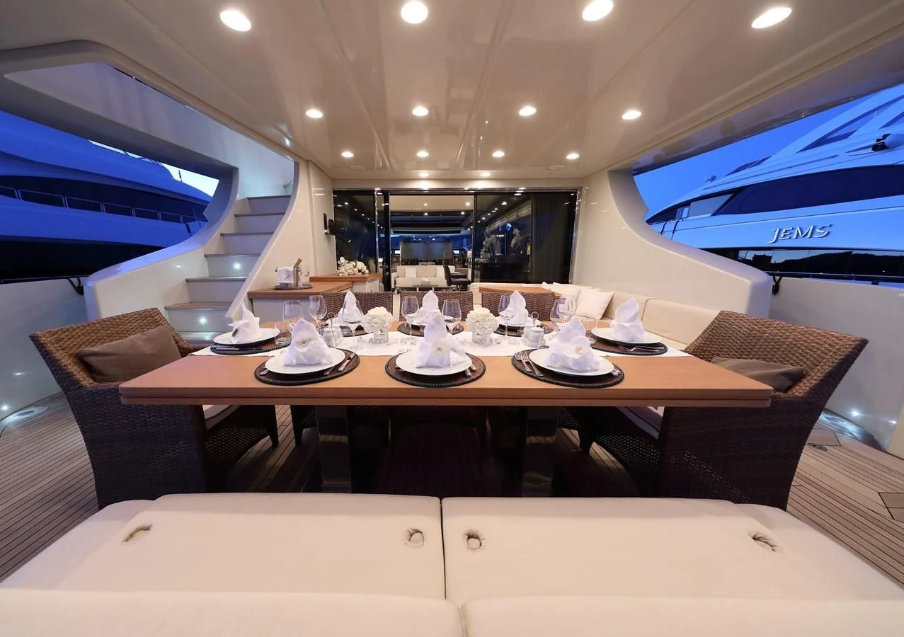 a restaurant with a table and chairs aboard PATRONESS Yacht for Sale